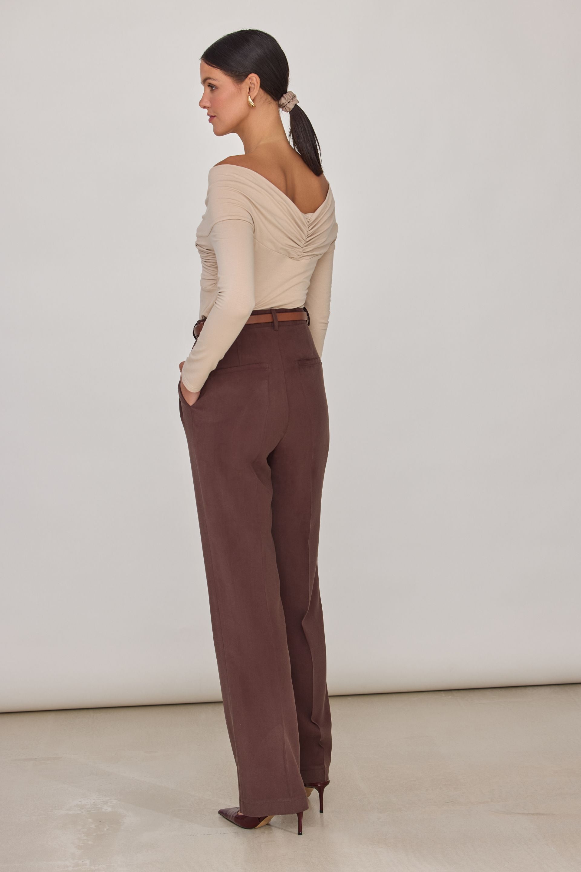 Brown off-the-shoulder blouse with long sleeves and a wrap