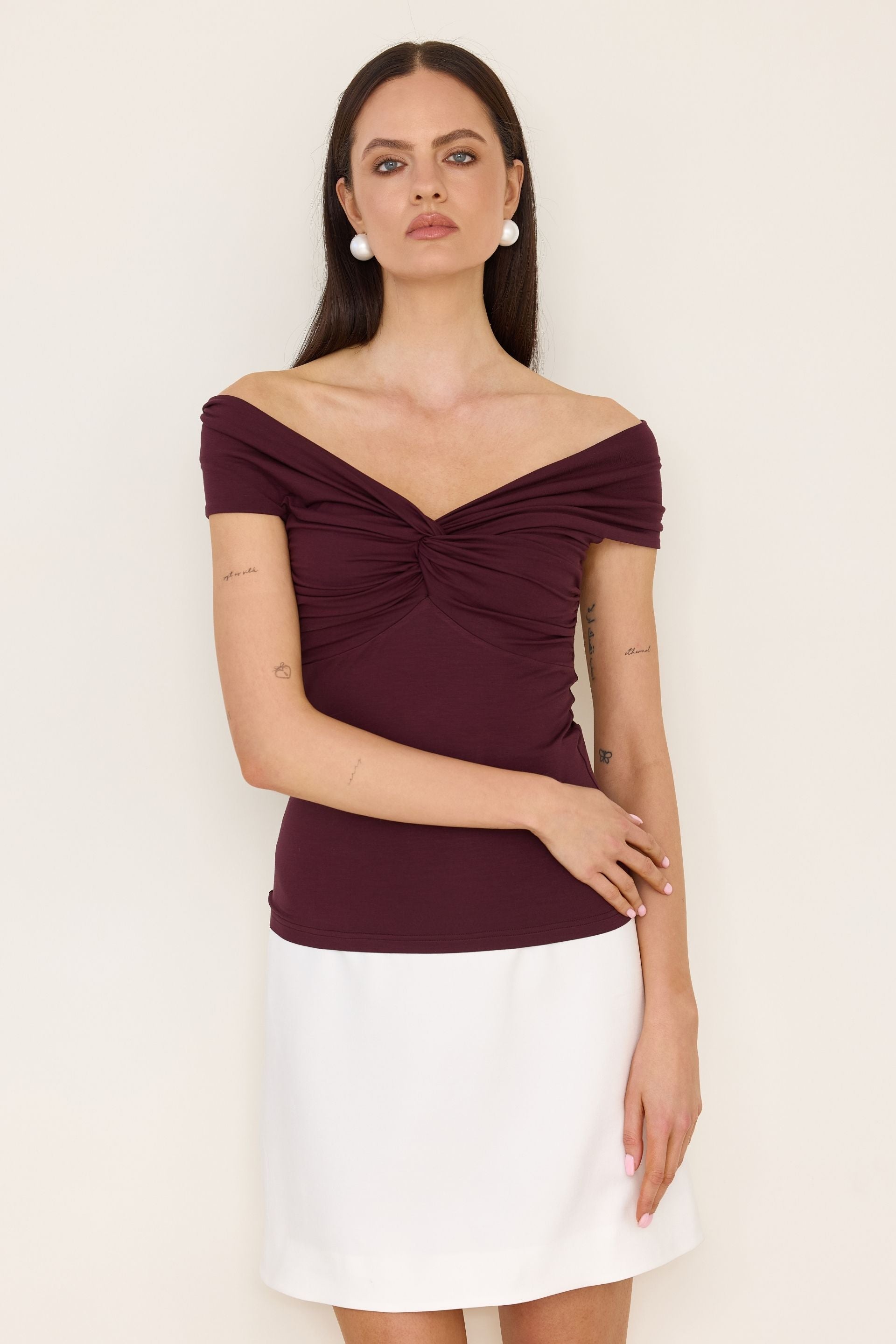 Red off-the-shoulder blouse with a roll-up