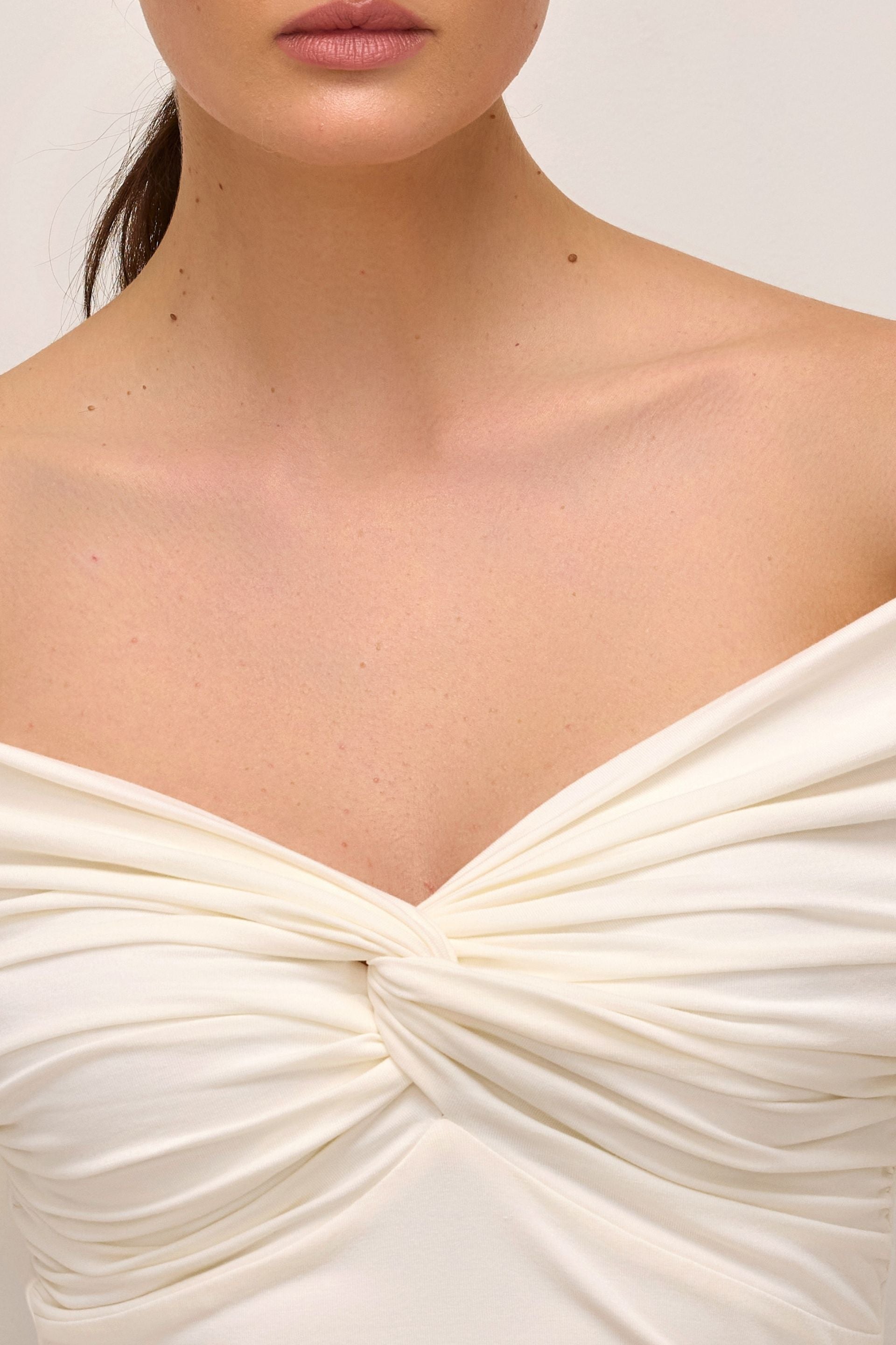 Off-the-shoulder blouse with a wrap and long sleeves, cream