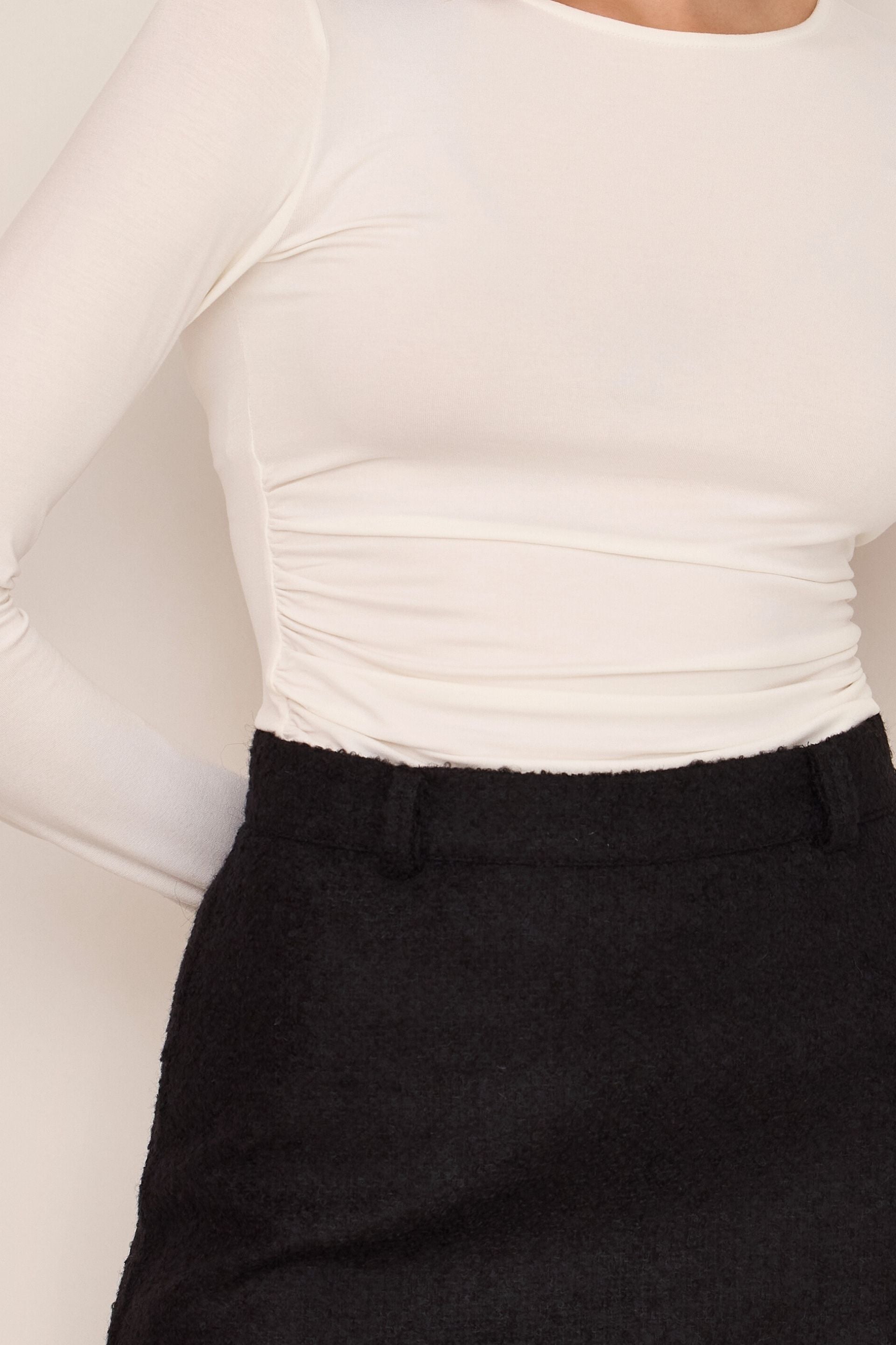 Creamy white blouse with draped sides