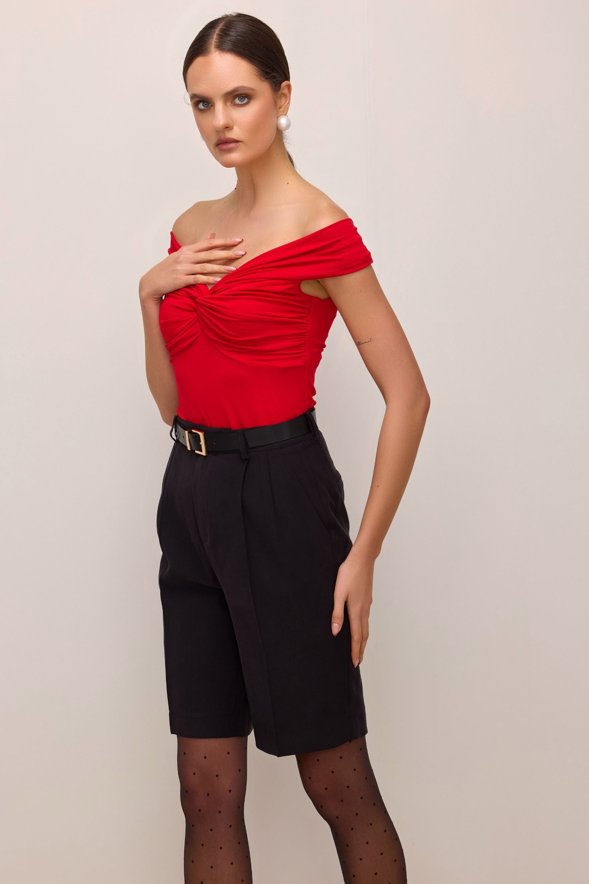 Red off-the-shoulder blouse with a roll-up