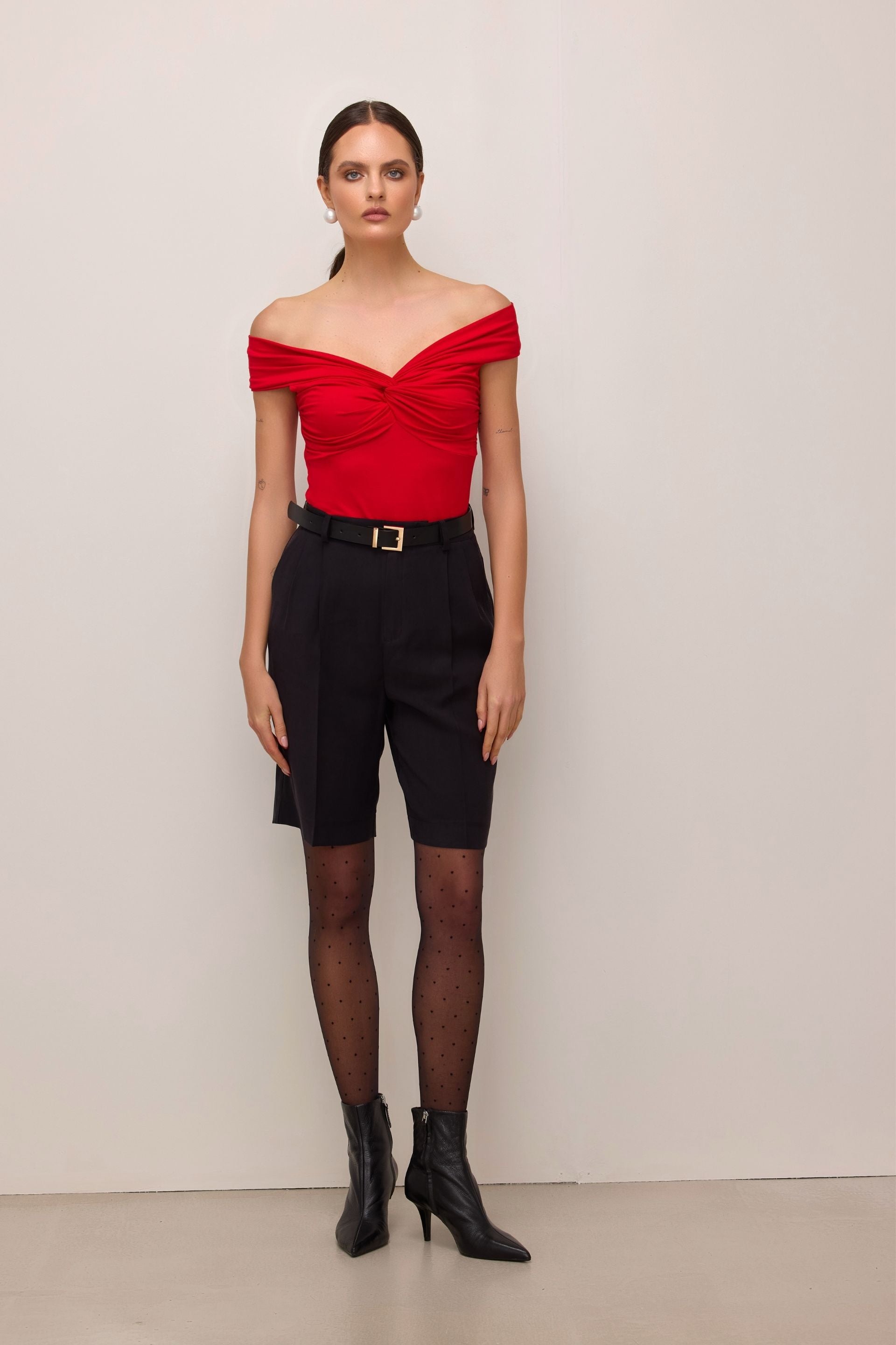 Red off-the-shoulder blouse with a roll-up