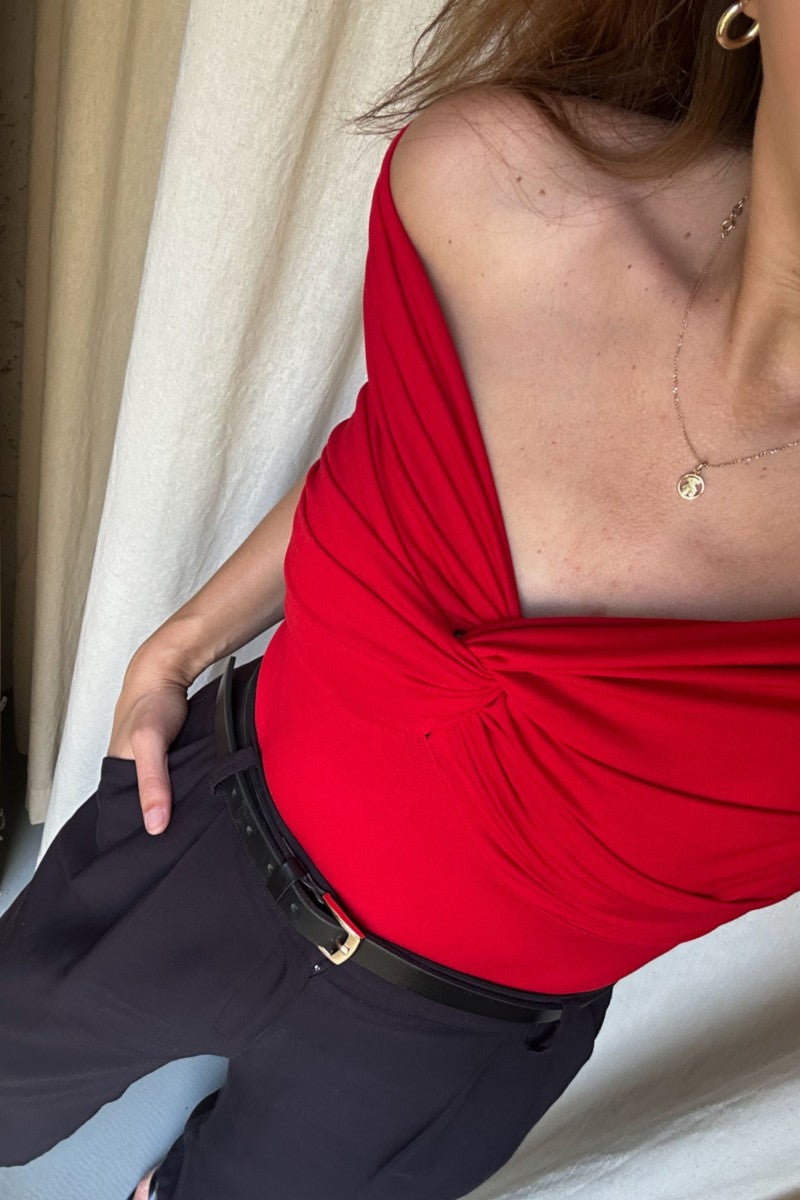 Red off-the-shoulder blouse with a roll-up