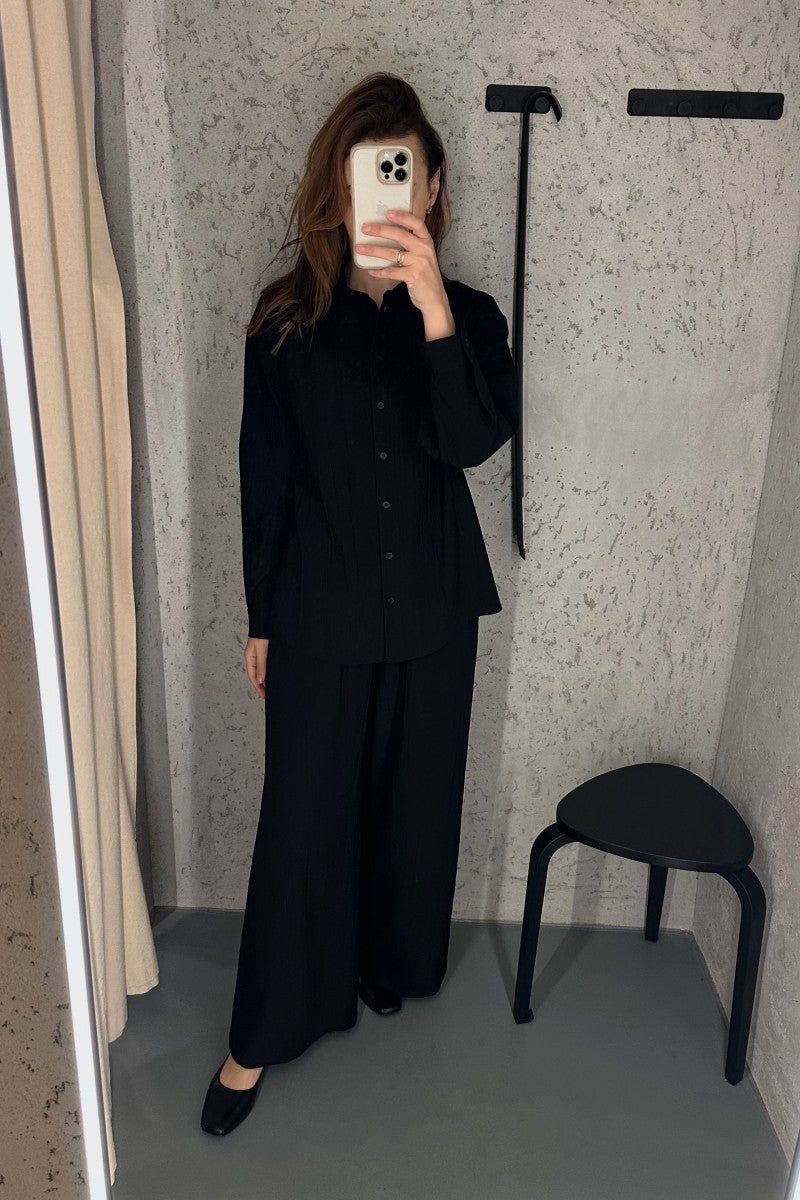 Black crinkled viscose trousers with elastic waistband