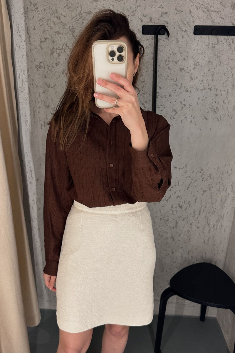 Cream bouclé skirt with a slightly trapezoidal shape