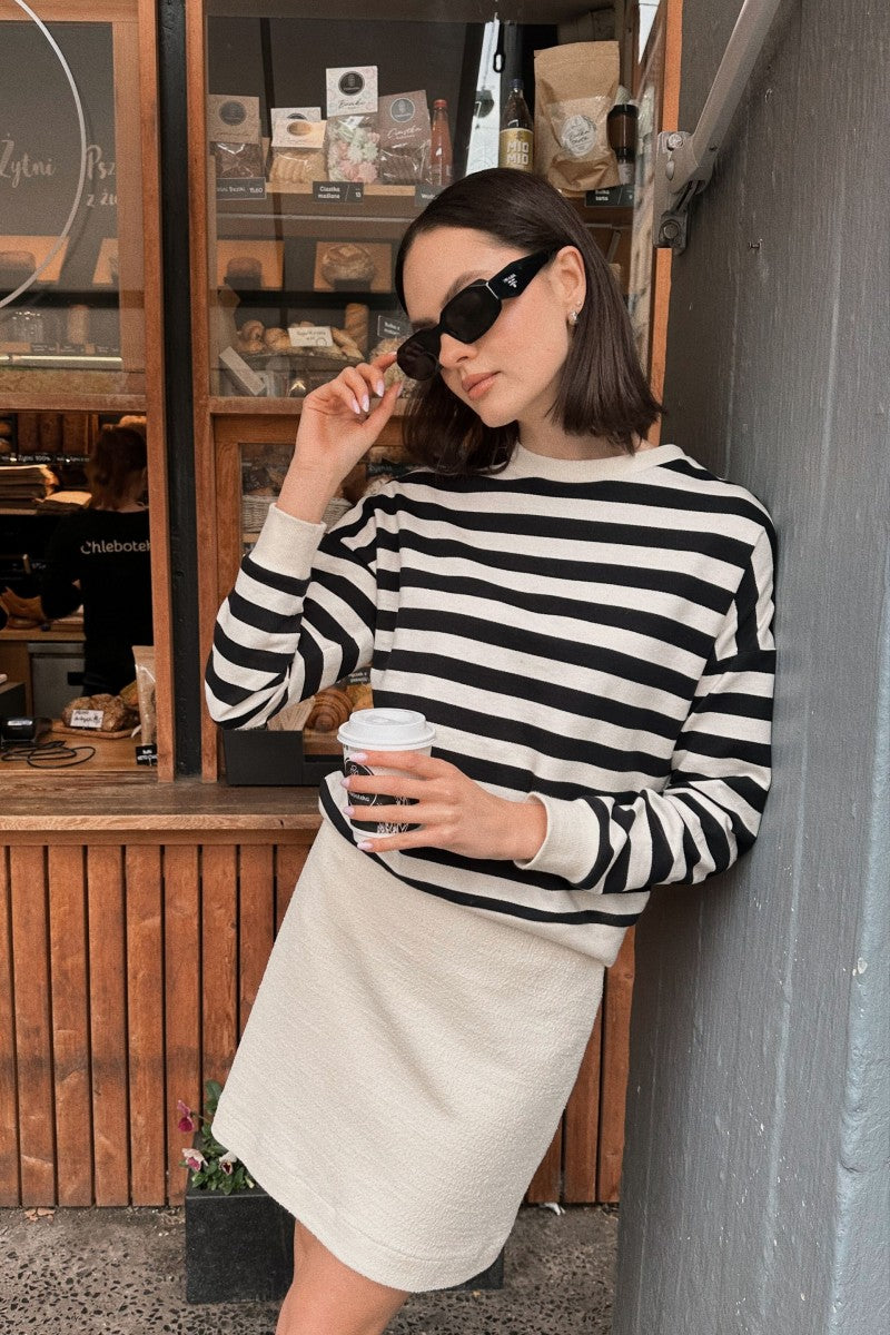 Cream bouclé skirt with a slightly trapezoidal shape