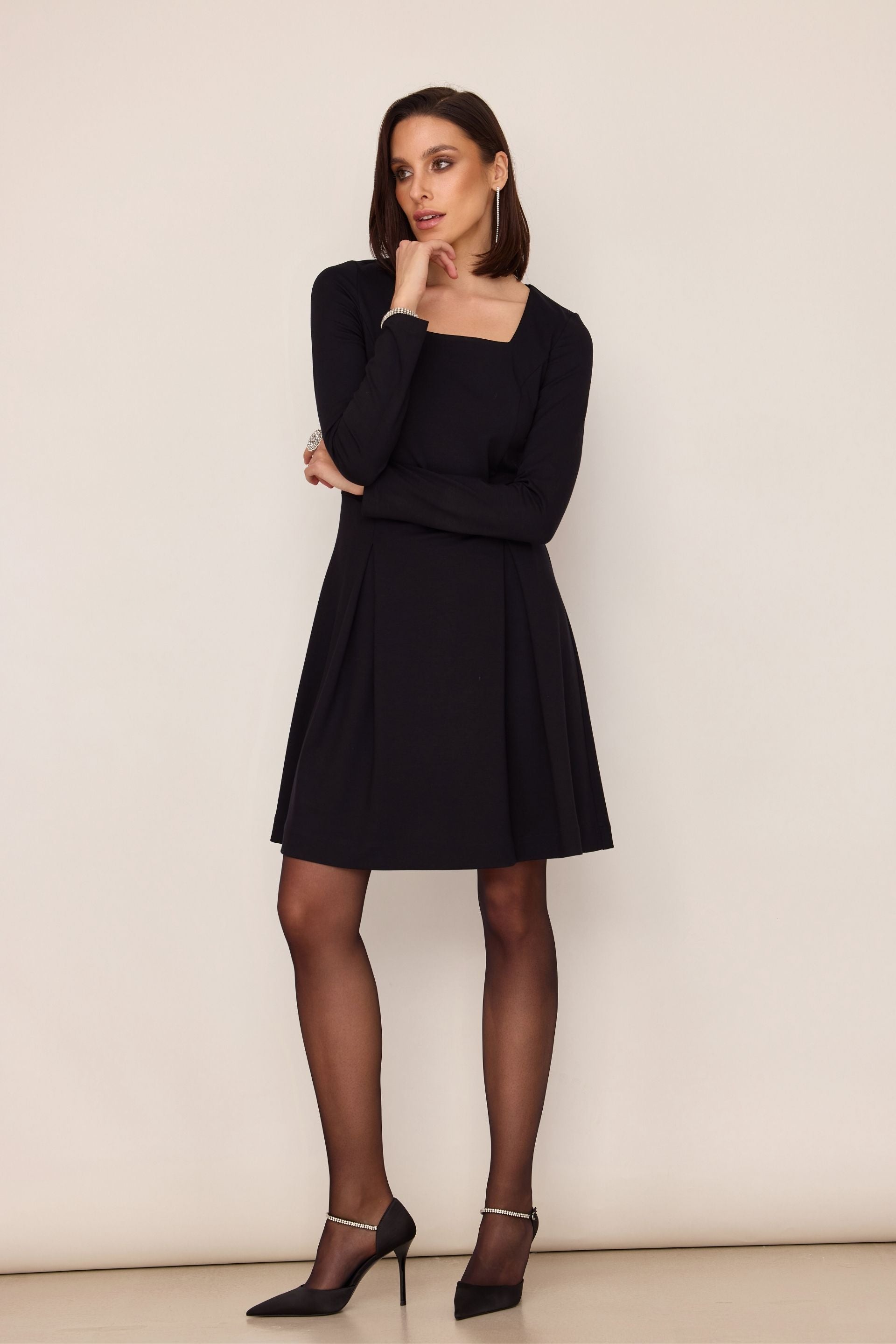 Black flared dress with a square neckline