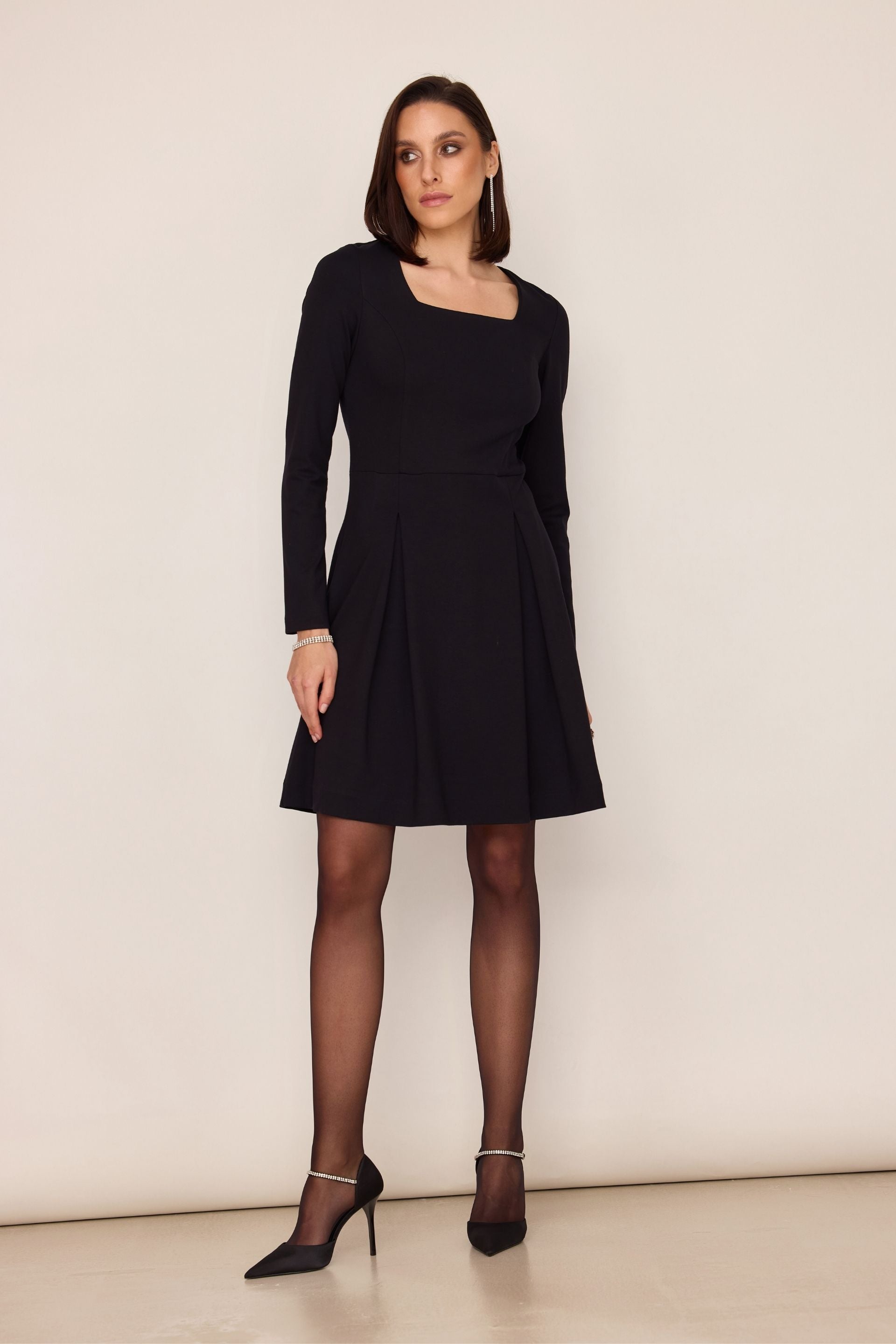 Black flared dress with a square neckline