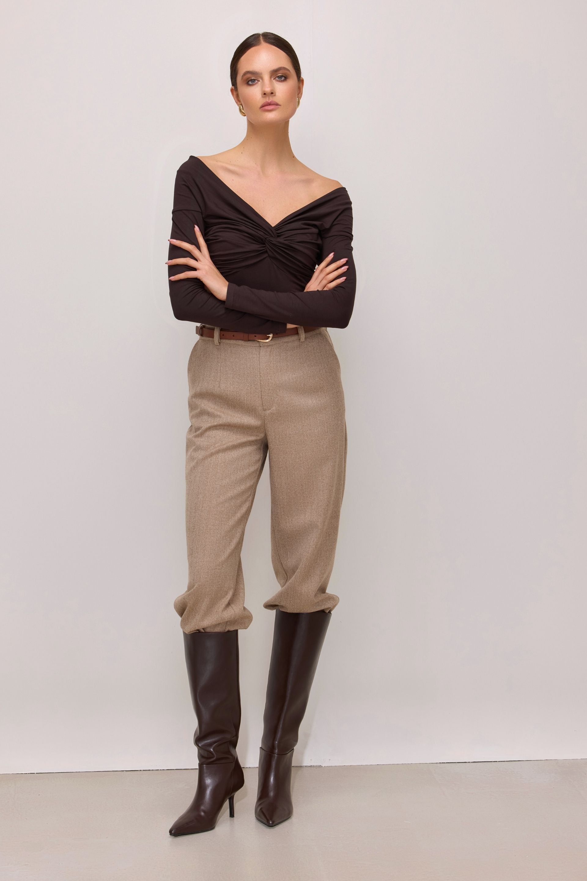 Brown off-the-shoulder blouse with long sleeves and a wrap
