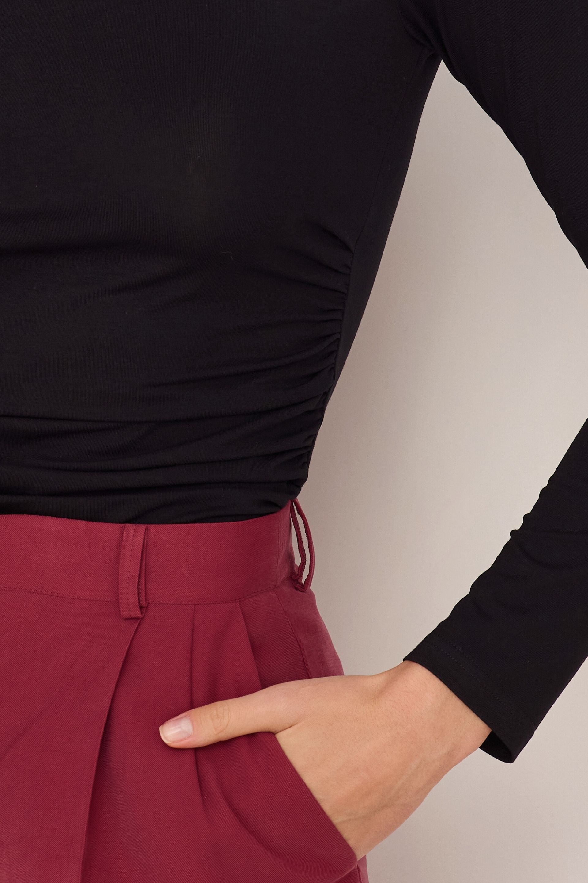 Black blouse with draped sides