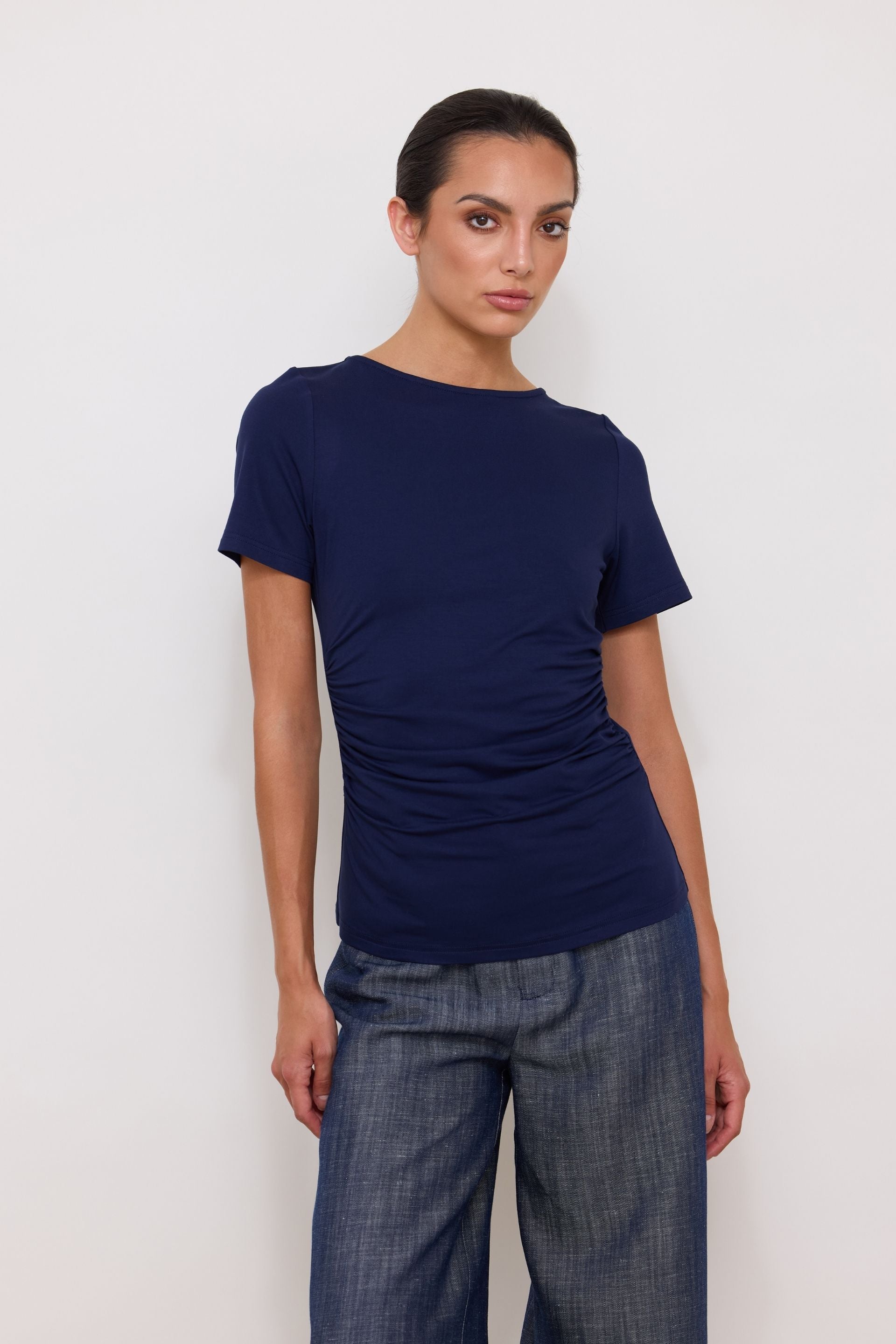 Navy blue short-sleeved blouse with draped sides