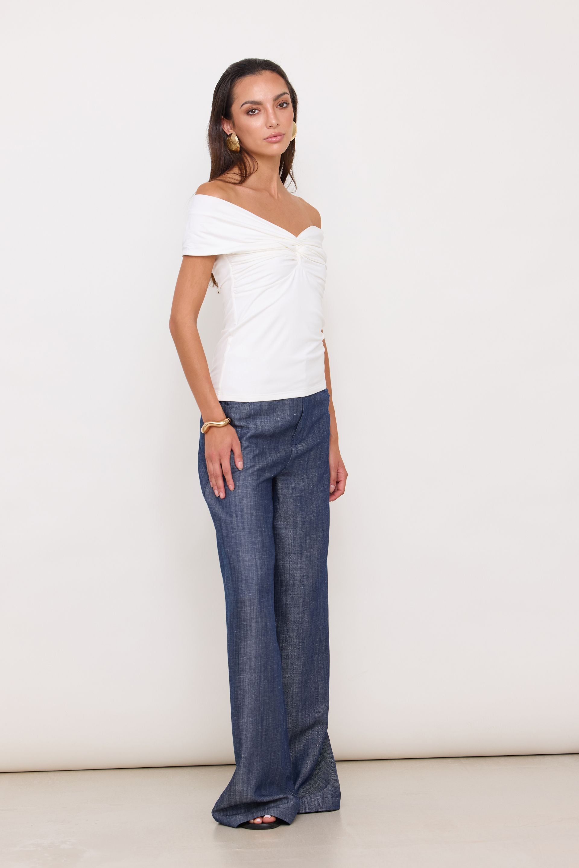 Cream off-the-shoulder blouse with a wrap
