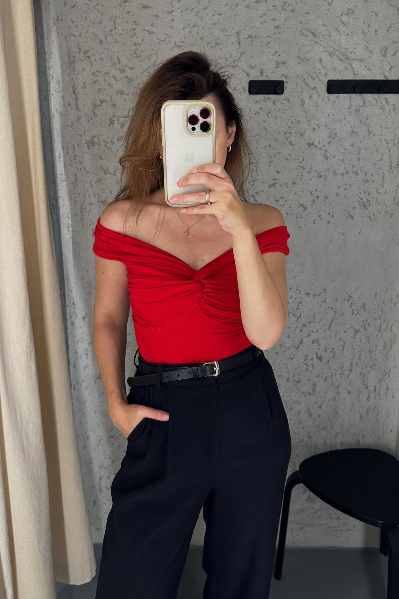 Red off-the-shoulder blouse with a roll-up