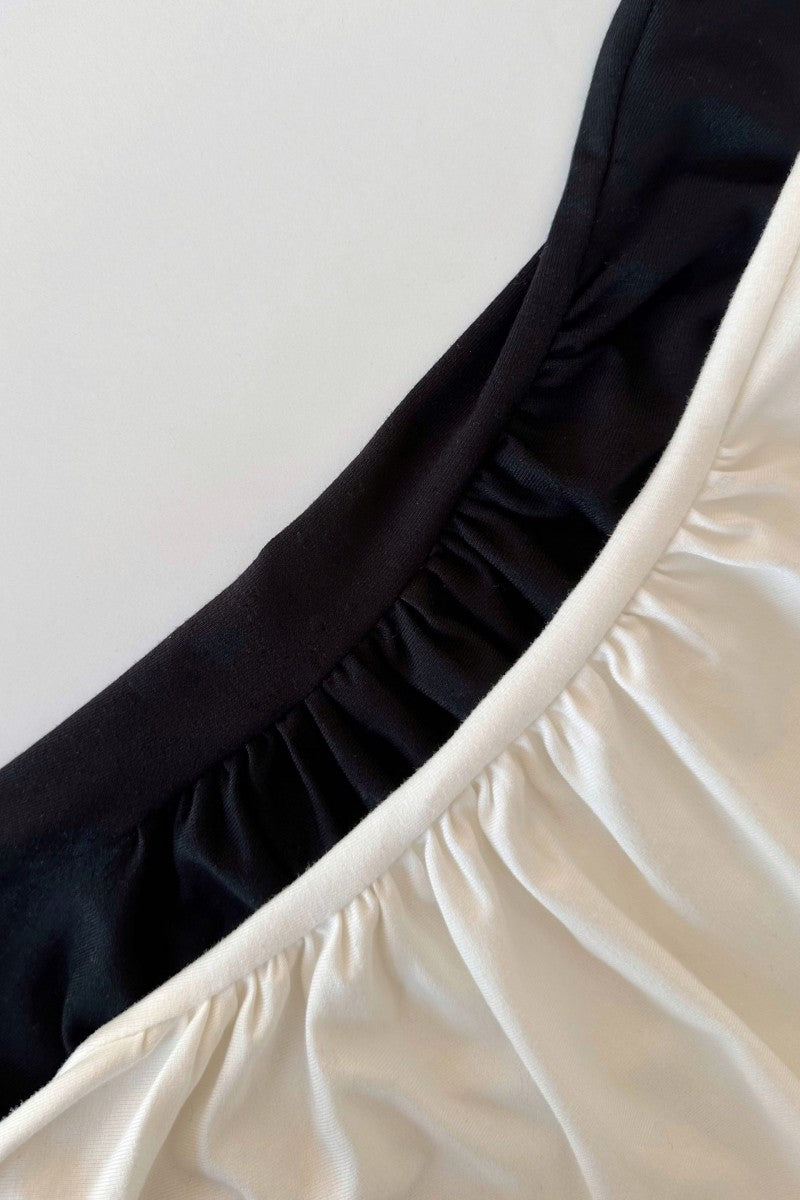 Creamy white blouse with draped sides