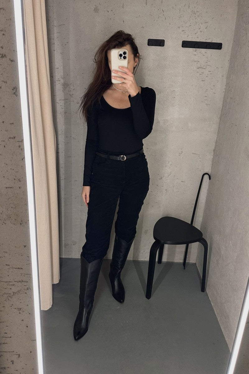 Black blouse with a large round neckline