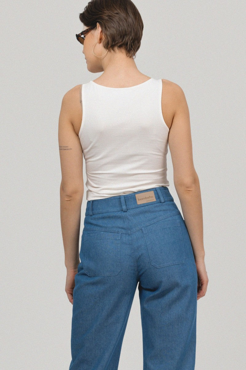 Navy blue denim trousers with patch pockets