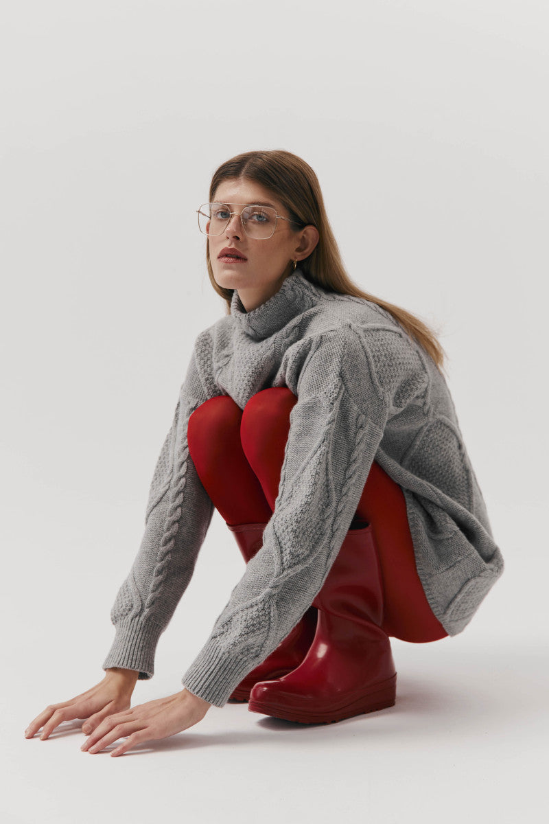 Gray cable-knit wool sweater