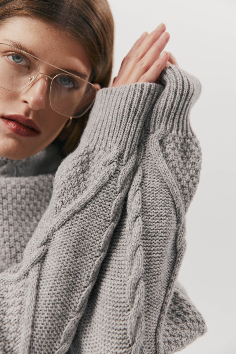 Gray cable-knit wool sweater